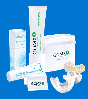 GumX+ periodontal care kit with toothpaste, gel, storage case, and two dental trays.